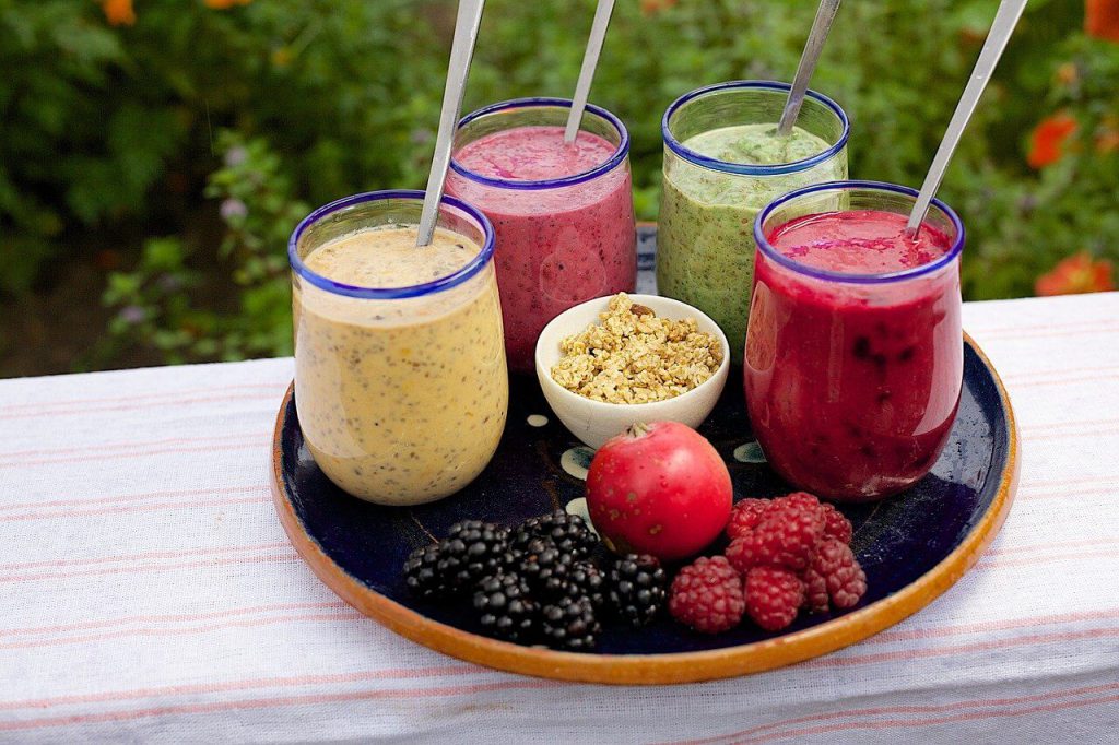 Four health smoothies on a tray